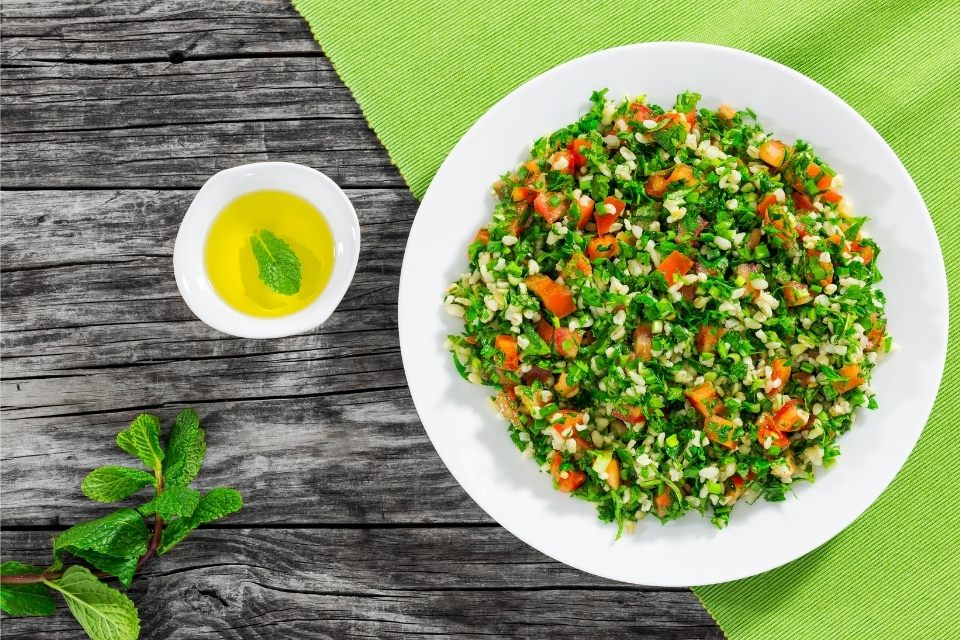 A plate of tabbouleh with parsley.