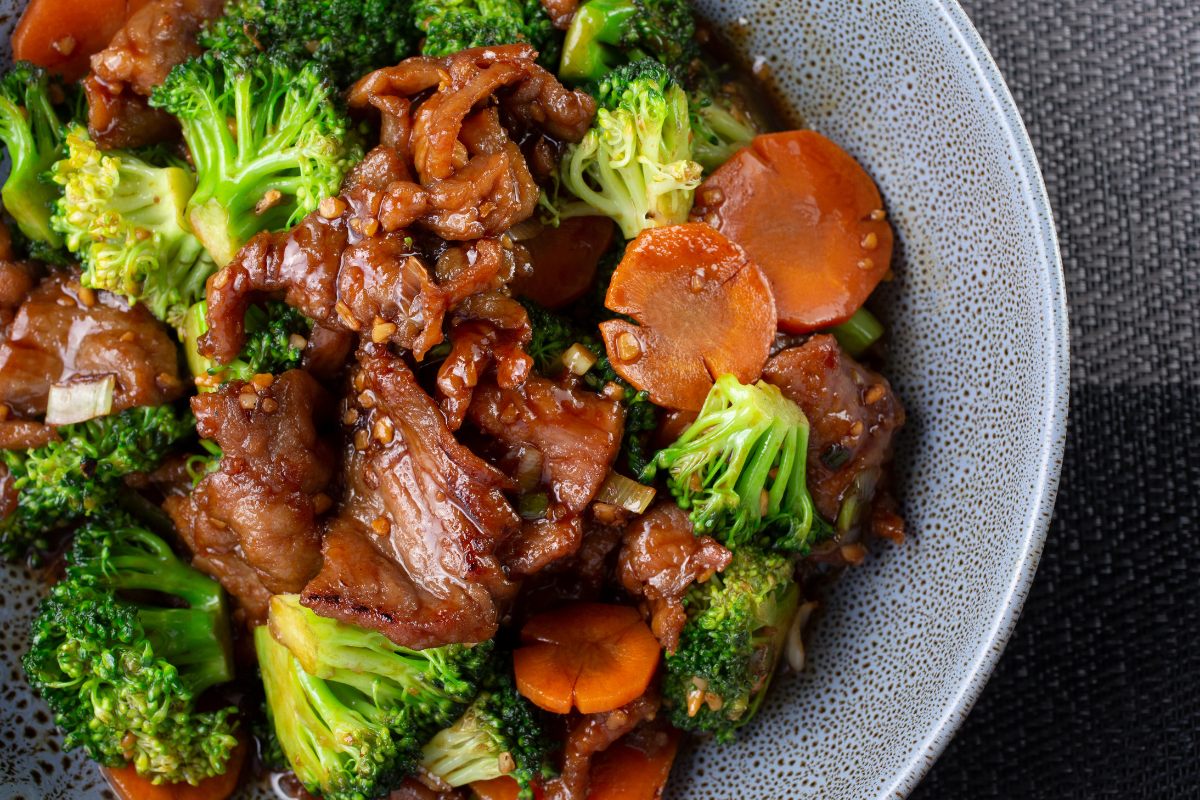 A bowl with beef and broccoli stir-fry.