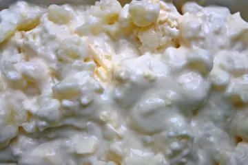 Coliflor con bechamel lista para el horno.