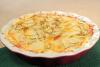 Patatas en rodajas al horno con cebollino.