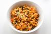 Arroz al estilo italian con queso Parmesano, tomate y espinacas.
