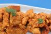 Trozos de pescado rebozados en una masa sencilla con perejil picado y fritos.